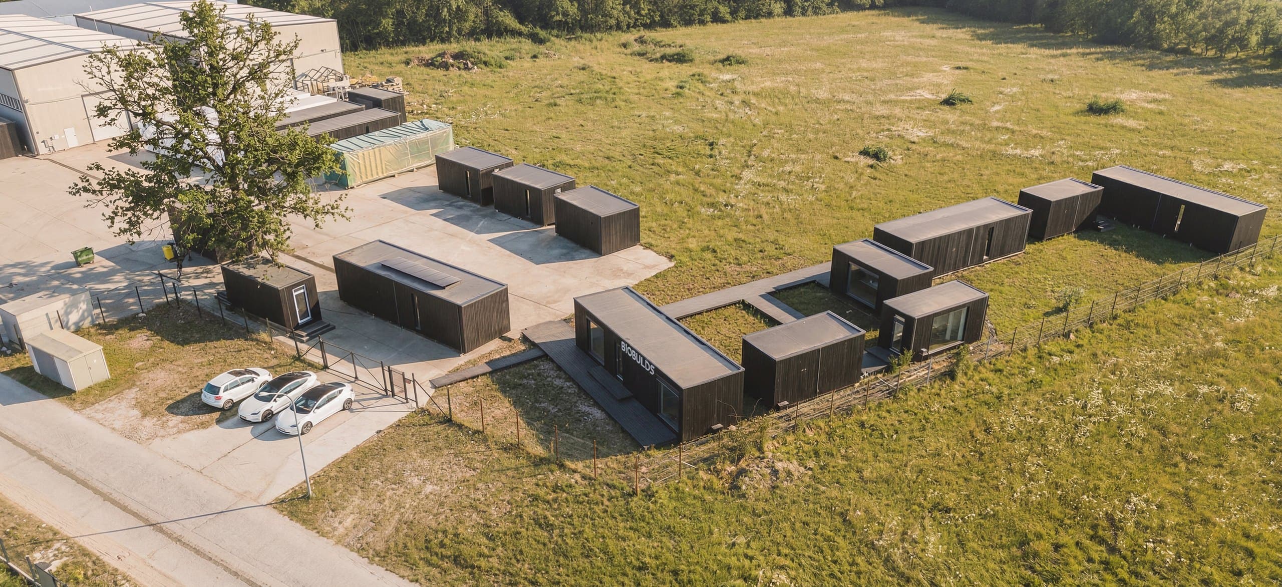 Aerial view of the BioBuilds factory and completed homes in Moreni, Romania.